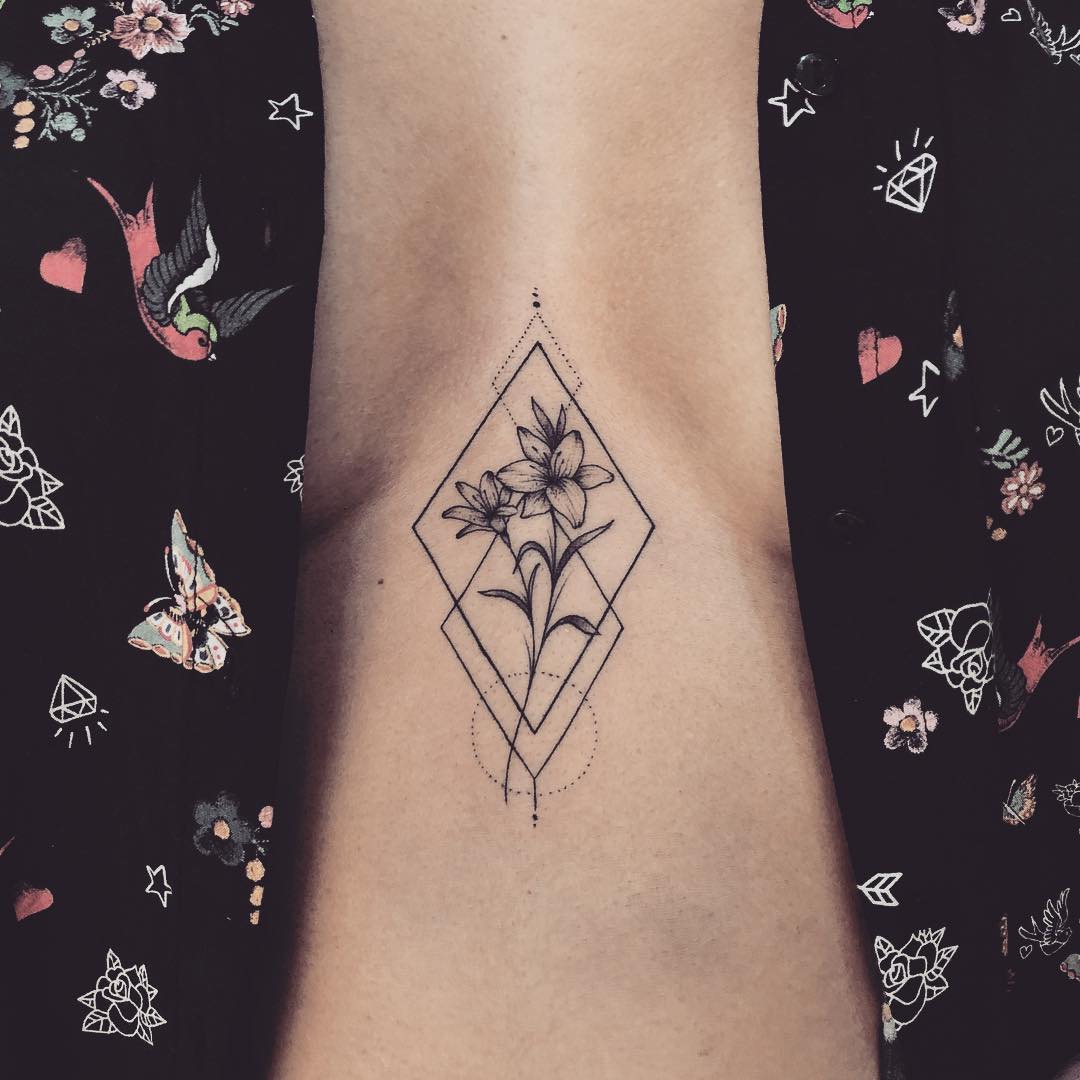 Flower in a rhombus tattoo on the sternum - Tattoogrid.net