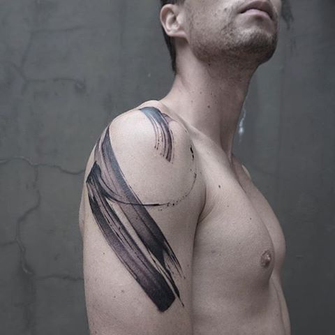 Abstract black tattoo on the arm