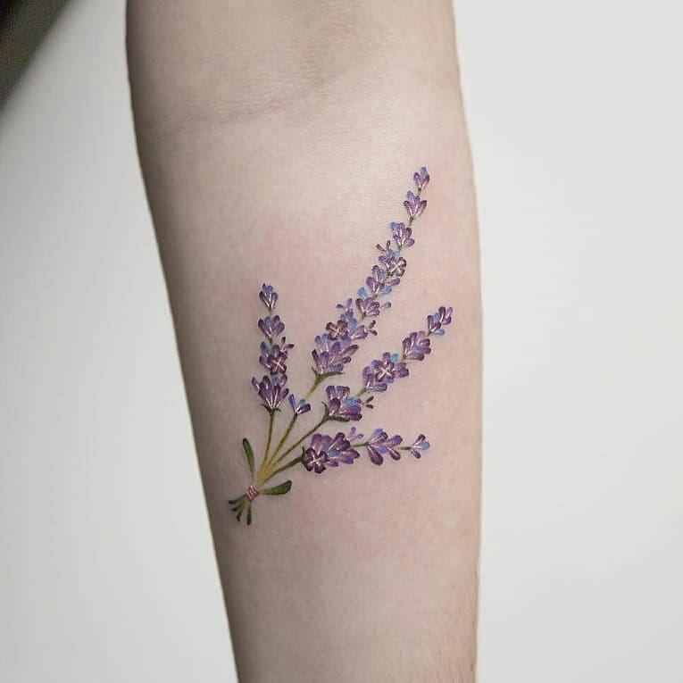 Beautiful wildflower tattoo on the arm