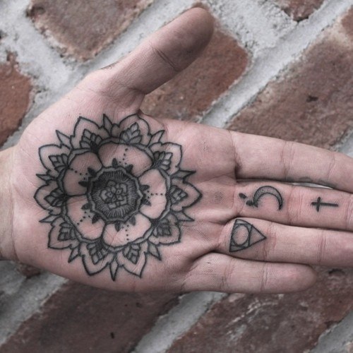 Black Mandala tattoo on the palm