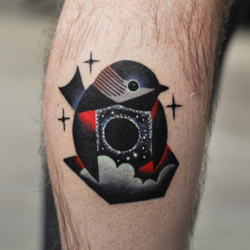 Black and red bird tattoo
