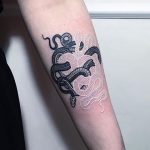 Black and white snake tattoo