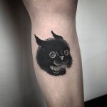 Black cat tattoo