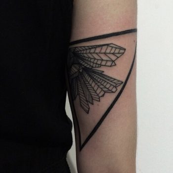 Black geometric tattoo on the arm