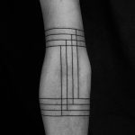 Black lines tattoo on the arm