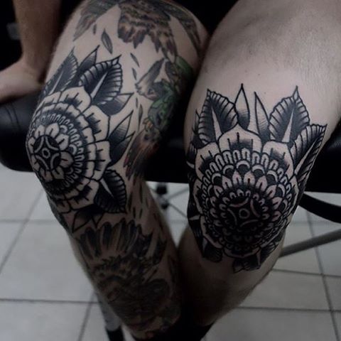 Black mandala tattoos on knees