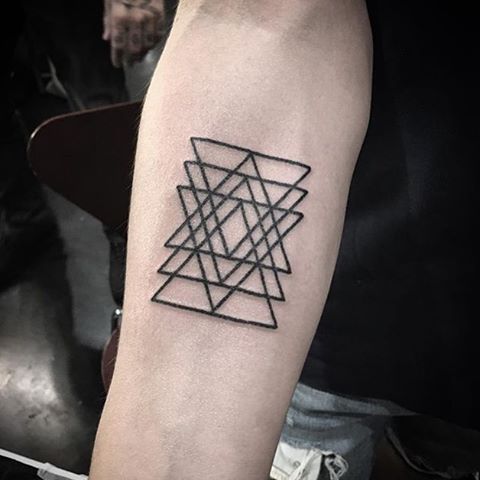 Black triangle tattoos on the arm 