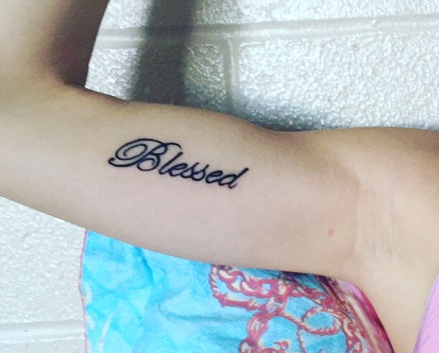 Blessed word tattoo