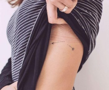 Broken arrow tattoo on the side