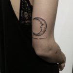 Crescent moon tattoo on the arm