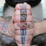 Dagger tattoo on the fingers