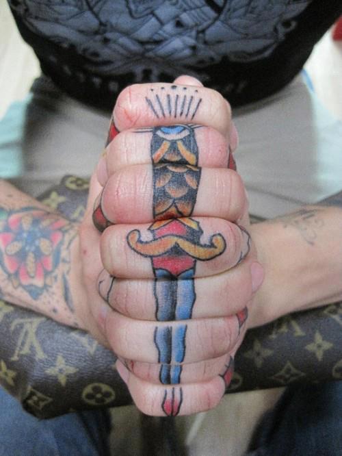 Dagger tattoo on the fingers