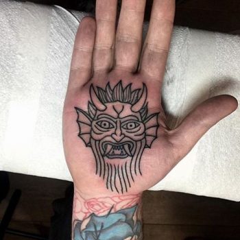 Devil tattoo on the palm