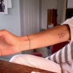 Double triangle tattoo on the inner arm
