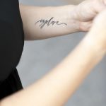 Explore tattoo on the left inner arm