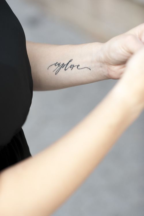 Explore tattoo on the left inner arm