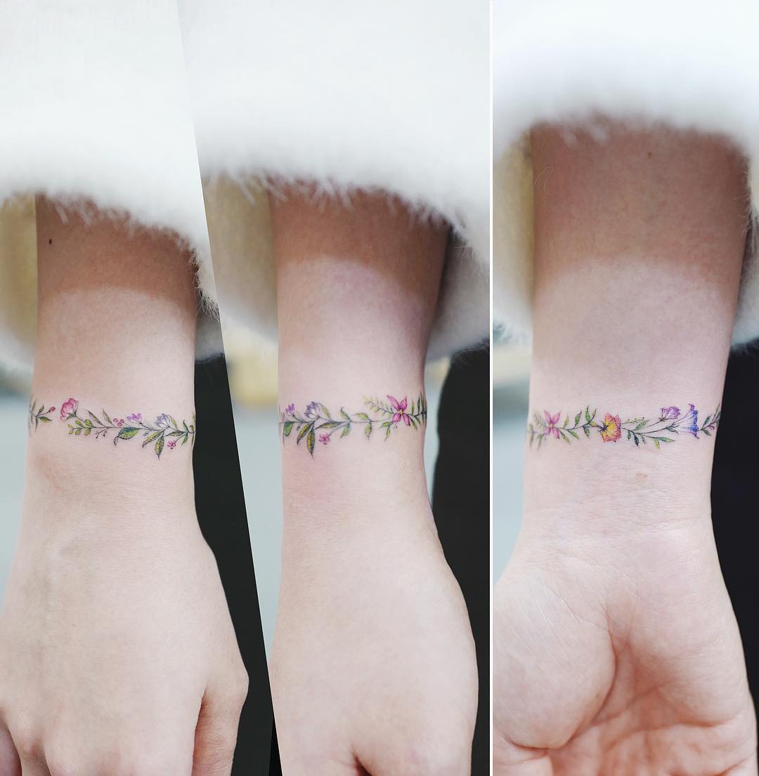 Floral bracelet tattoo