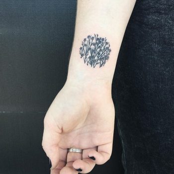 Floral circle tattoo