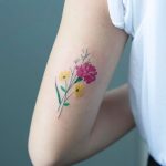 Flower bouquet tattoo on the arm