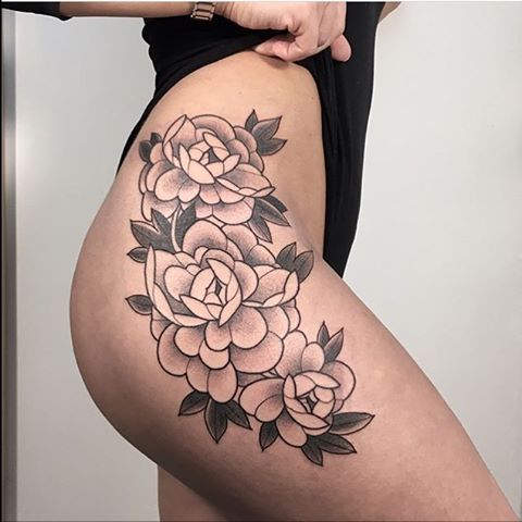 Flower tattoo on the hip 