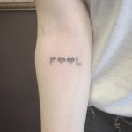 Fool tattoo on the arm