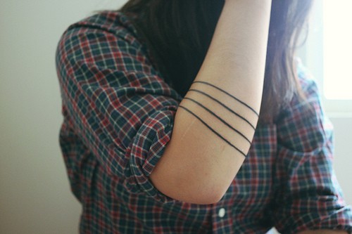 Four lines tattoo