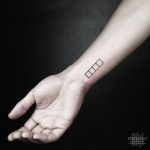 Four squares tattoo on the wrist