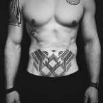 Geometric tattoo on the belly