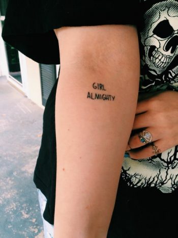 Girl almighty quote tattoo on the inner arm