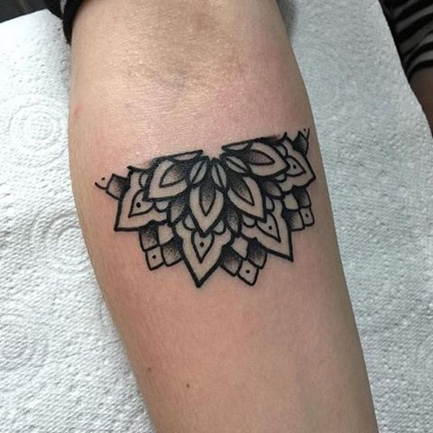 Half mandala tattoo on the inner arm
