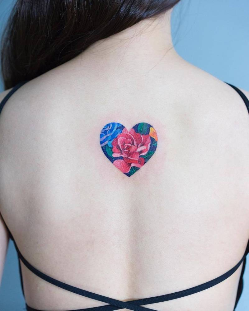 Heart filled with flowers tattoo