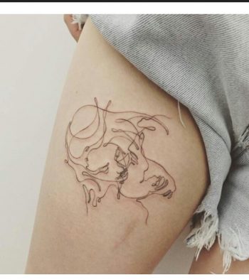 Kissing couple tattoo