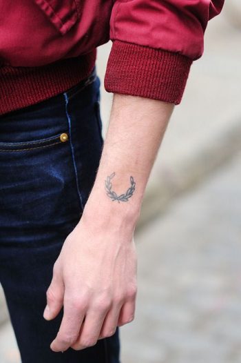 Laurel wreath tattoo on the arm