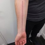 Long thin line tattoo