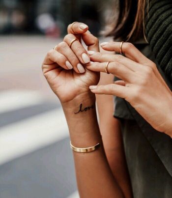 Love tattoo on the wrist