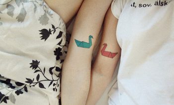 Matching swan tattoos