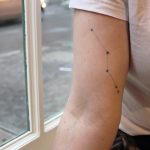 Minimal constellation tattoo on the arm