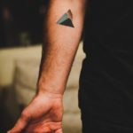 Minimal mountain tattoo on the inner arm