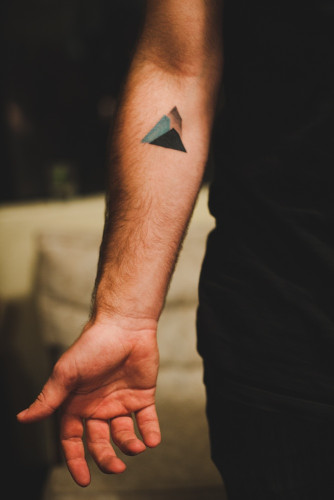 Minimal mountain tattoo on the inner arm