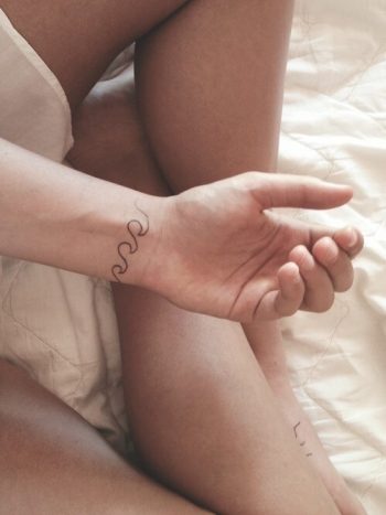 Minimalist wave tattoo