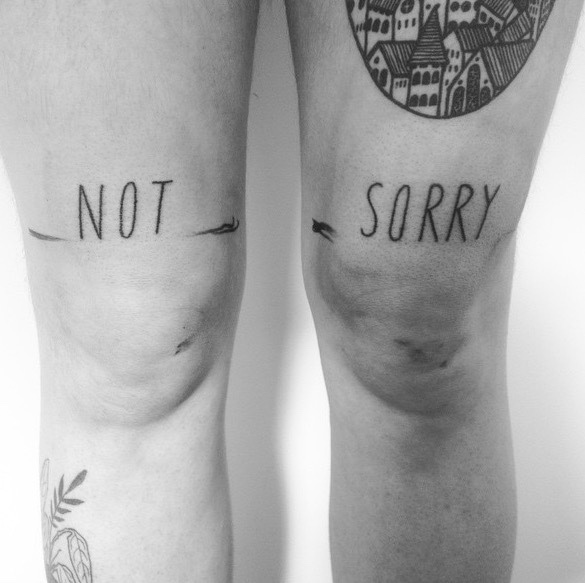 Not sorry tattoo on the legs