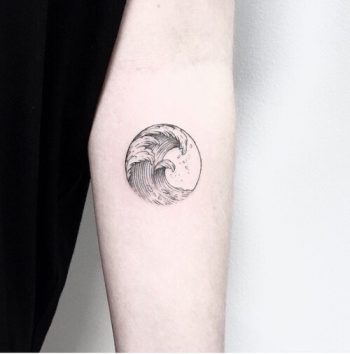 Osaka wave tattoo on the inner arm