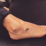 Paper plane tattoo on the foot