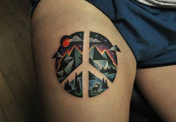 Peace sign tattoo on the thigh