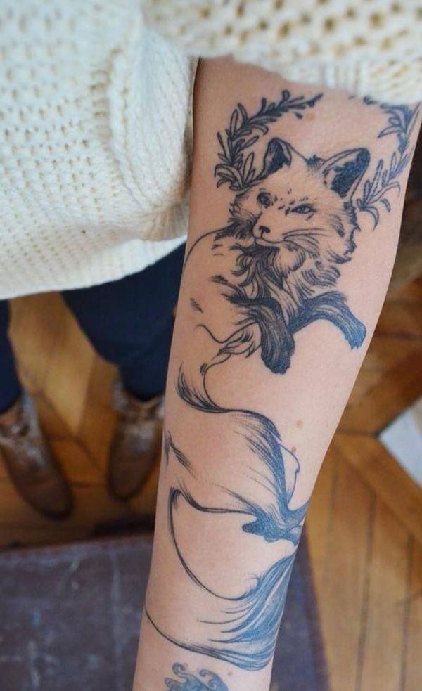Realistic fox tattoo on the arm