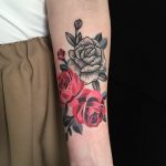 Red and black rose tattoo