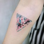 Sakura in a triangle tattoo