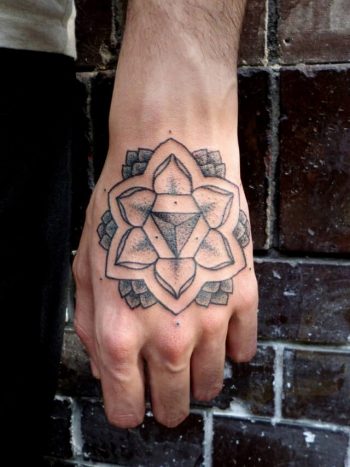 Simple lotus flower tattoo on the hand