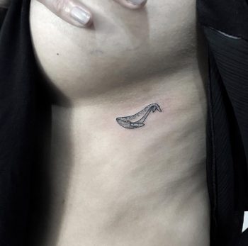 Small whale underboob tattoo