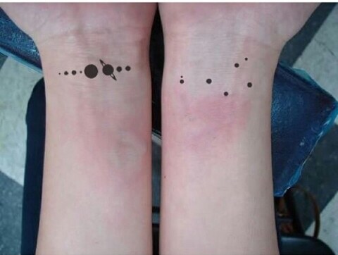 Solar system planets tattoo on both wrists